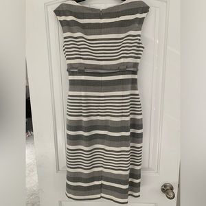 Gray and white striped dress. Zipper in back. Grey/silver belt.
